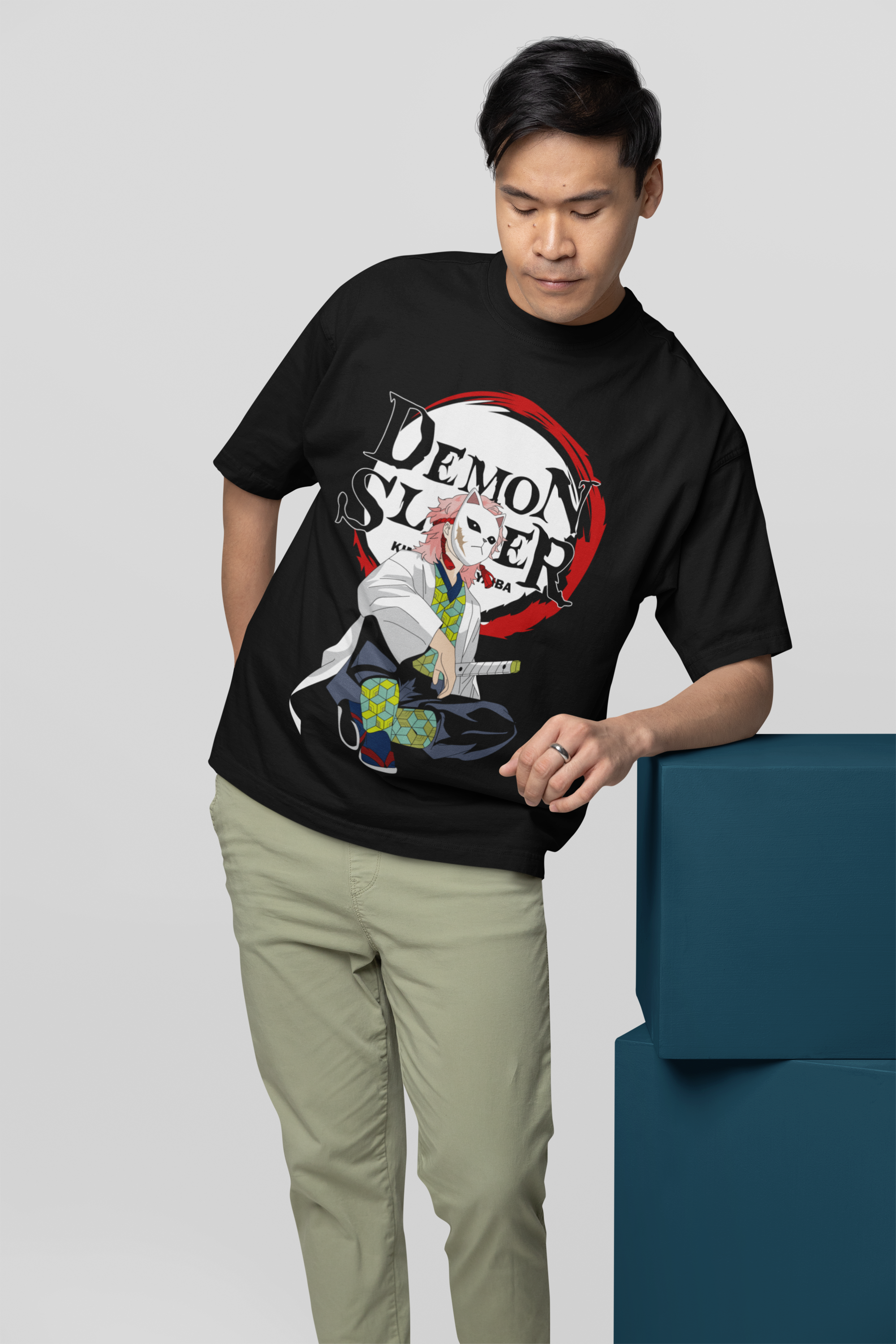 files/oversized-t-shirt-mockup-featuring-a-man-leaning-on-a-colorful-cube-m38921.png